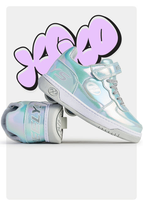 Pair of iridescent Girls Heelys roller shoes with a colorful 'XO' design on a white background