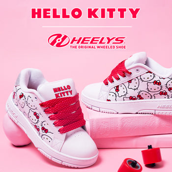 Hello Kitty Girls Heelys roller shoes on a pink background